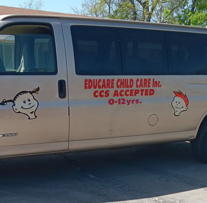 Childcare center van with vinyl lettering and logo graphics