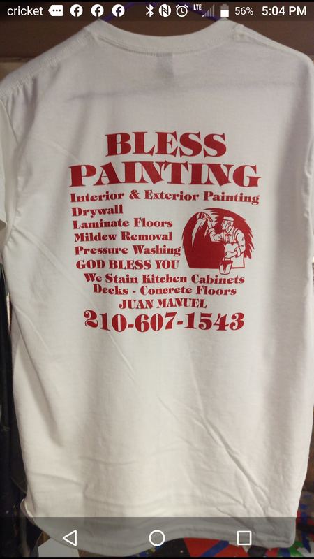 Custom printed painting company t-shirt hanging in the shop