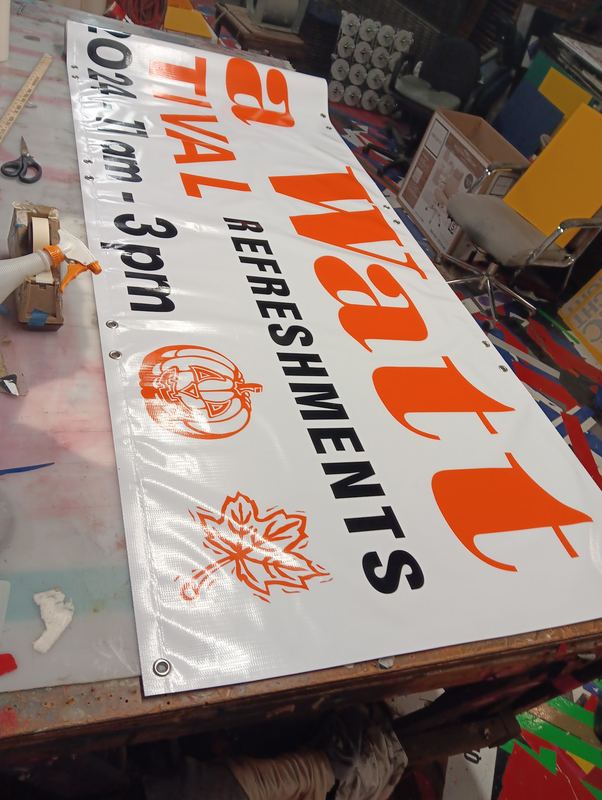 Custom printed festival event banner with times and refreshments