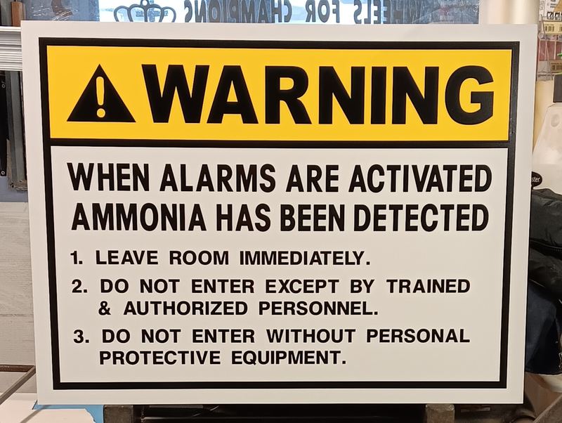 OSHA style warning safety sign for an ammonia alarm system
