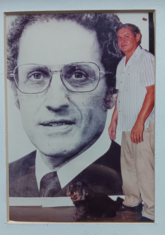 Framed portrait of the founder displayed in the Rayco sign shop