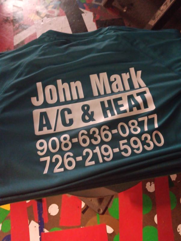 Green screen printed contractor work shirt with company name and phone