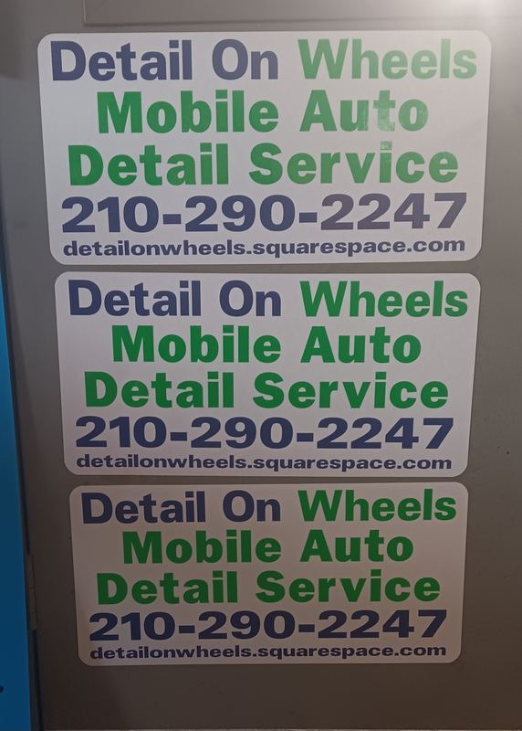 Stack of finished custom vehicle magnets ready for pickup